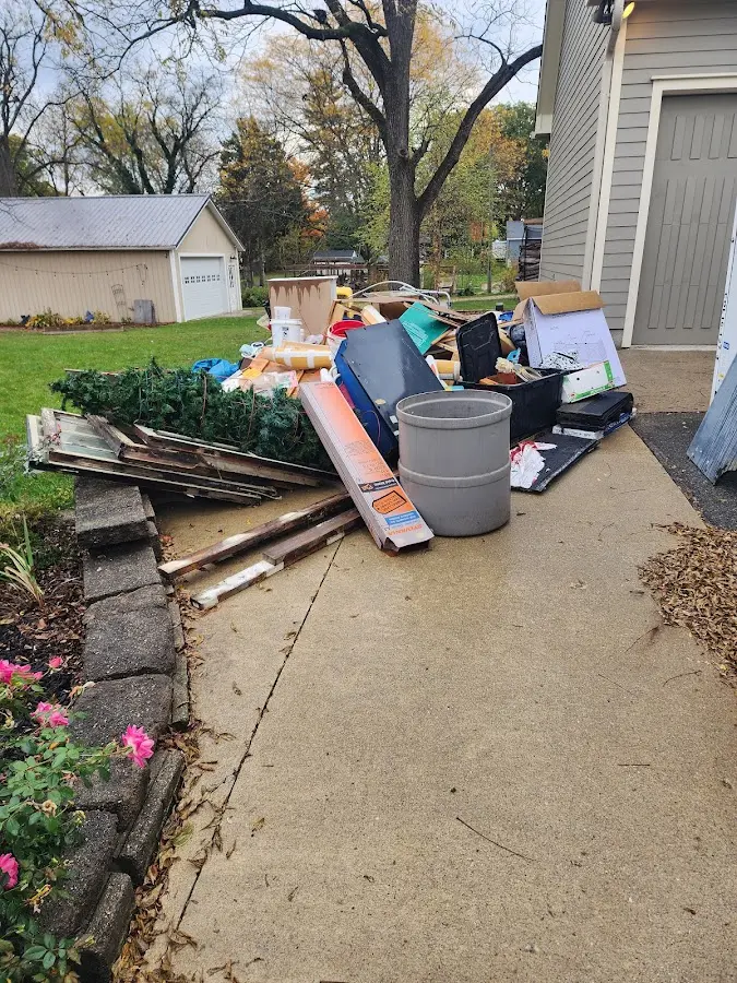Dumpster being loaded with debris for Roofing Dumpster Rental in Limerick